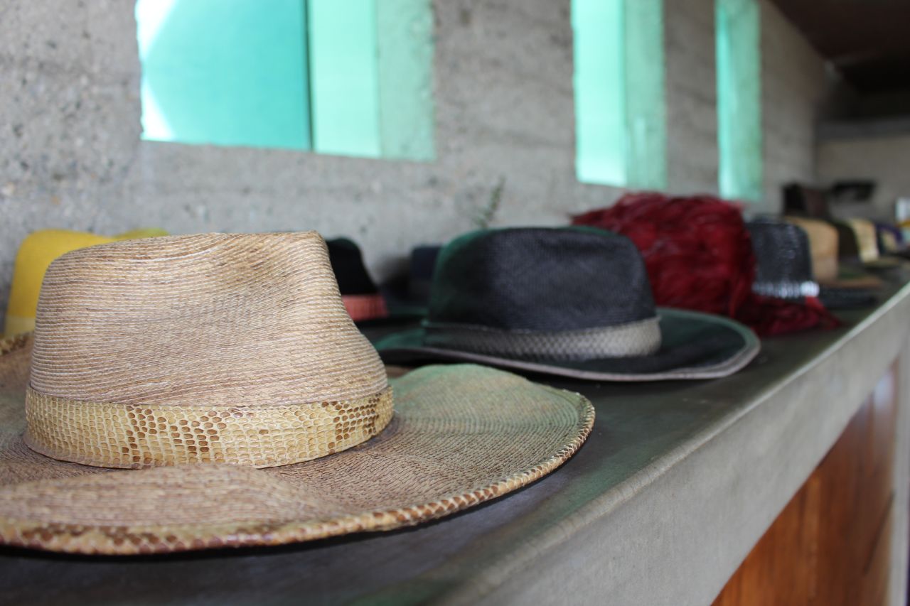 Never spotted without a hat, Goldstein displays a custom-designed collection by the walls of his bedroom. Glass windows above the hats peer into the architectural marvel's swimming pool. 
