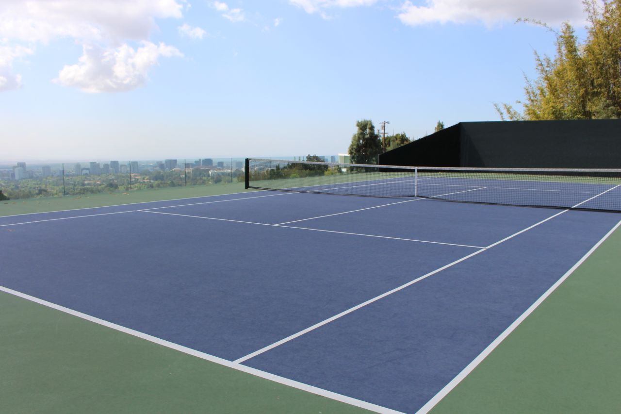 Goldstein's "infinity tennis court" sits above Club James and is the scene of morning rallies between the owner and hitting coach Tony Graham. It also serves as the site of annual fundraiser events, and has been featured in commercials with Maria Sharapova and Roger Federer. 