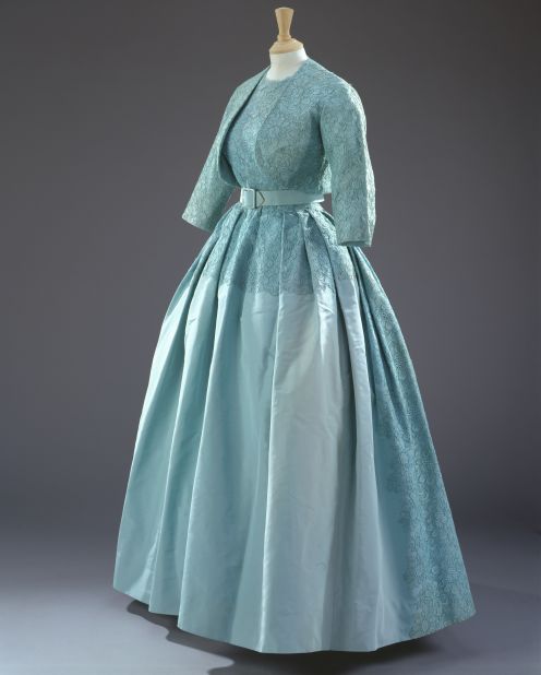 Turquoise dress with a matching bolero jacket of silk taffeta, guipure lace and silk tulle by Norman Hartnell, worn to Princess Margaret's wedding.
