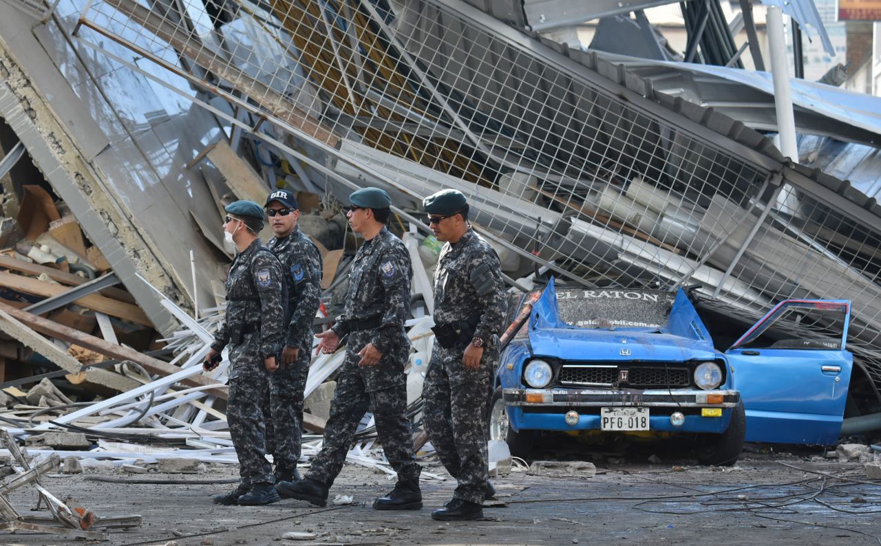 Rescuers search for survivors in Manta on April 19.