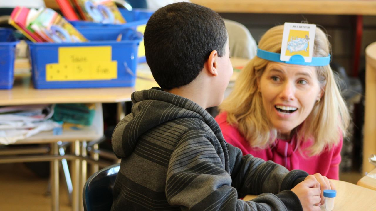 CNN's Kelly Wallace takes part in a game of Hedbanz during reading instruction at P.S. 94 in the Bronx.