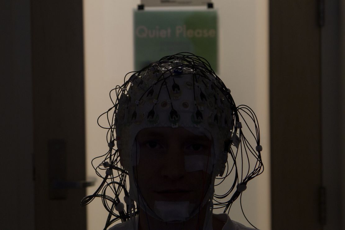 Electrodes monitor a person's brain activity as they sleep.
