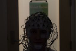 Electrodes monitor a person's brain activity as they sleep.