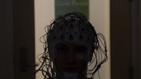 Electrodes monitor a person's brain activity as they sleep.