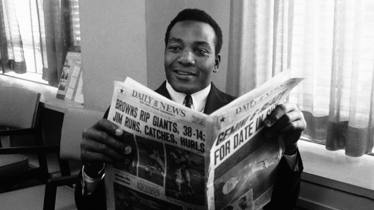 Cleveland fullback Jim Brown, seen here reading a story about himself in the New York Daily News in 1965, retired from the NFL in 1966 at age 30. Brown played for the Cleveland Browns for nine seasons, winning the NFL championship in 1964, the last year the city of Cleveland won a major championship. Brown was a nine-time Pro Bowler and was inducted into the Pro Football Hall of Fame in 1971.