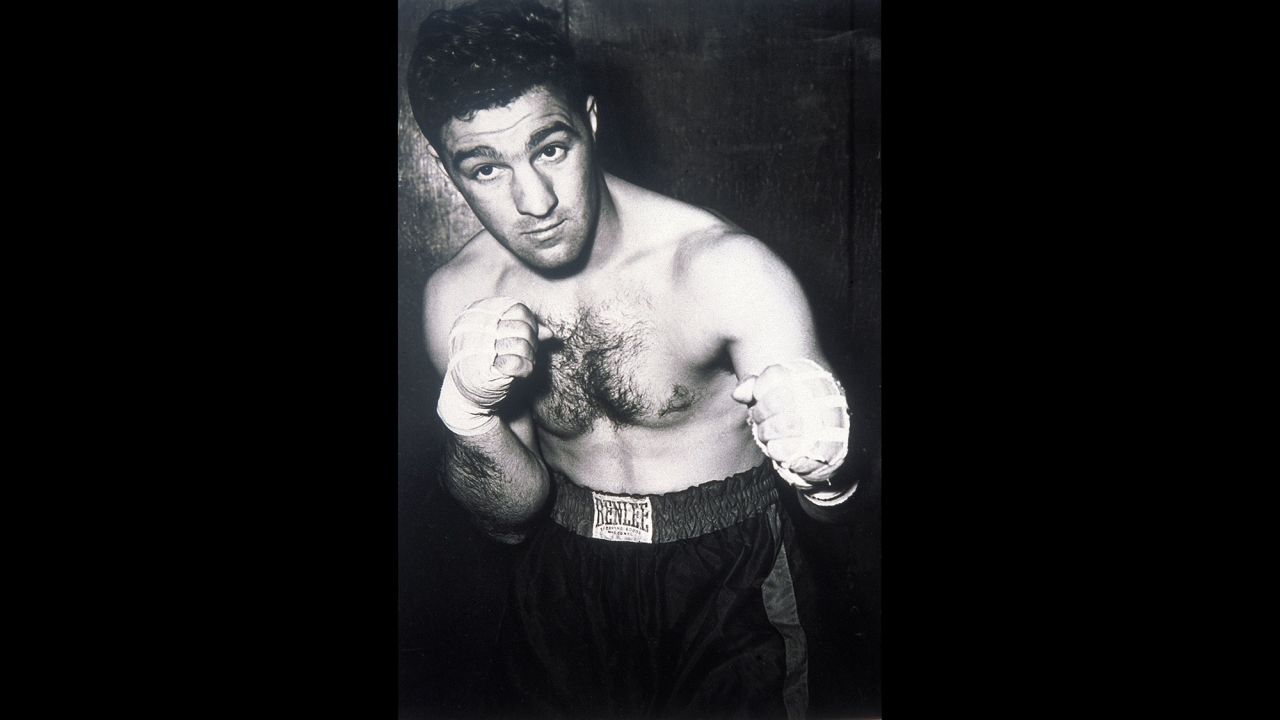 World heavyweight champion Rocky Marciano, seen here in 1955, announced on April 27, 1956, that he was retiring from boxing at age 31. Marciano, who had a perfect 49-0 record with 43 knockouts, said he wanted to spend more time with his family. He died in a plane crash in 1969 at age 45.