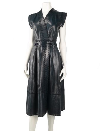 The internationally successful British fashion designer Jean Muir created couture-quality ready-to-wear designs. With her superlative cutting and use of luxurious fabrics, Muir excelled in making technically complex designs that appeared simple, such as this butter-soft nappa leather dress. <br /><br />In 2005, National Museums Scotland was fortunate to acquire her archive of an estimated 18,000 items. This piece is a favourite of mine as it is typical of the timeless, feminine designs that made her popular with so many high-profile clients, including her former house model Joanna Lumley.