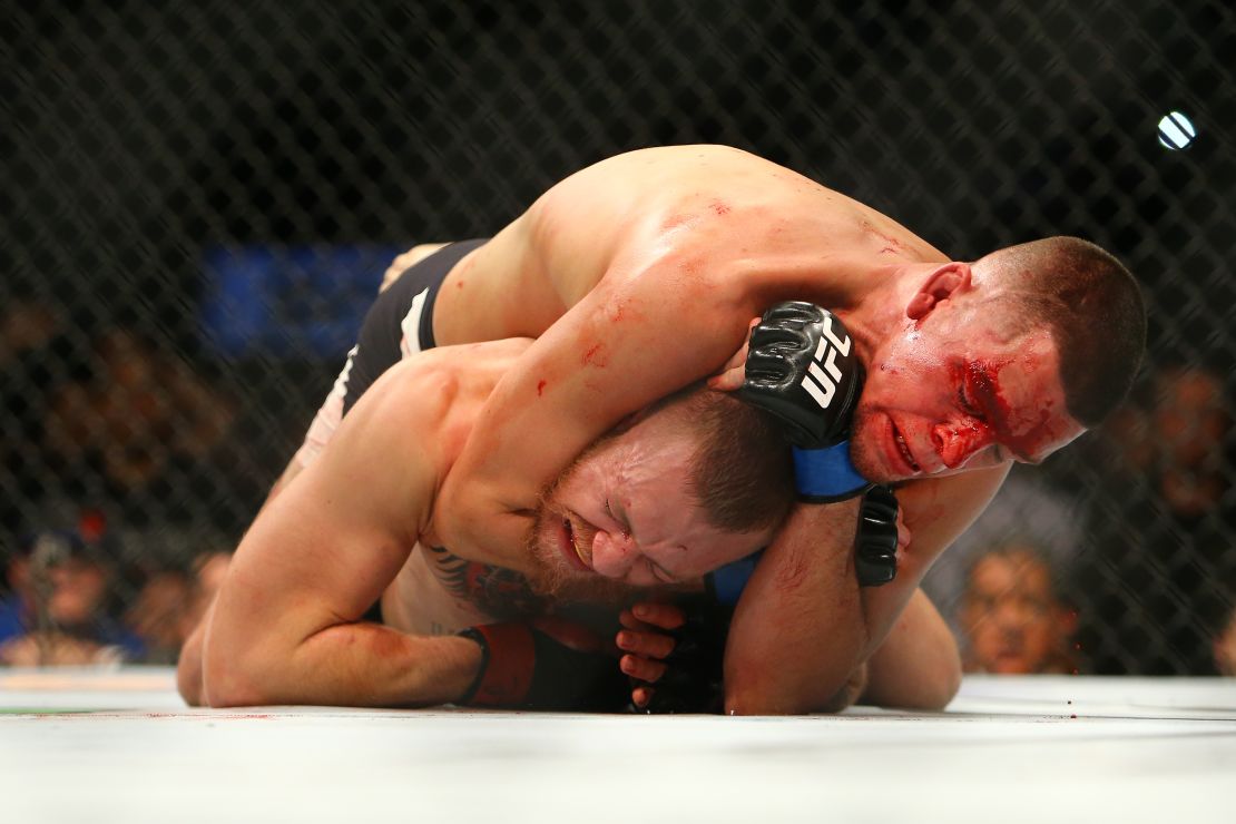 Nate Diaz chokes Conor McGregor at UFC 196.