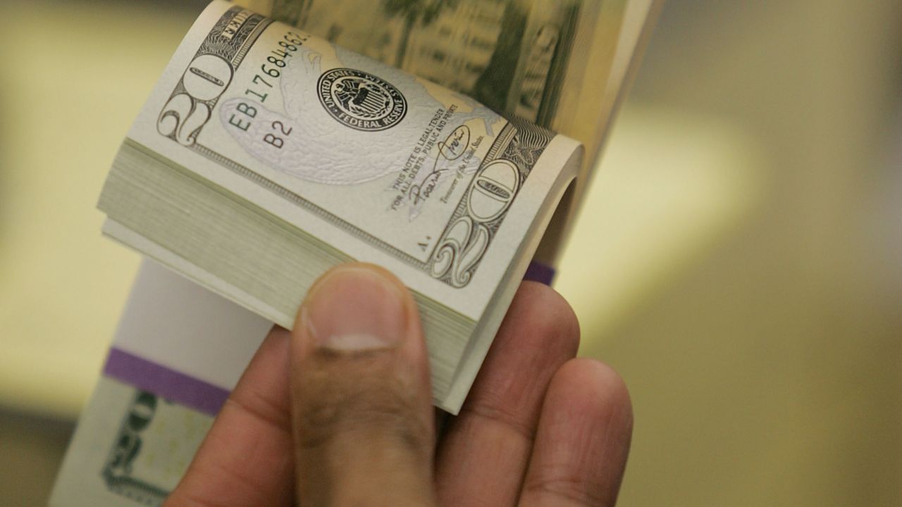 WASHINGTON - APRIL 20: A worker looks for defective bills in a bundle of newly printed twenty dollar bills as they are prepared for distribution to financial institutions April 20, 2005 at the Department of the Treasury Bureau of Engraving and Printing in Washington, DC. Regardless of its denomination, a bill, or banknote, costs 6 cents to produce. A dollar bill lasts about 22 months.  (Photo by Joe Raedle/Getty Images)