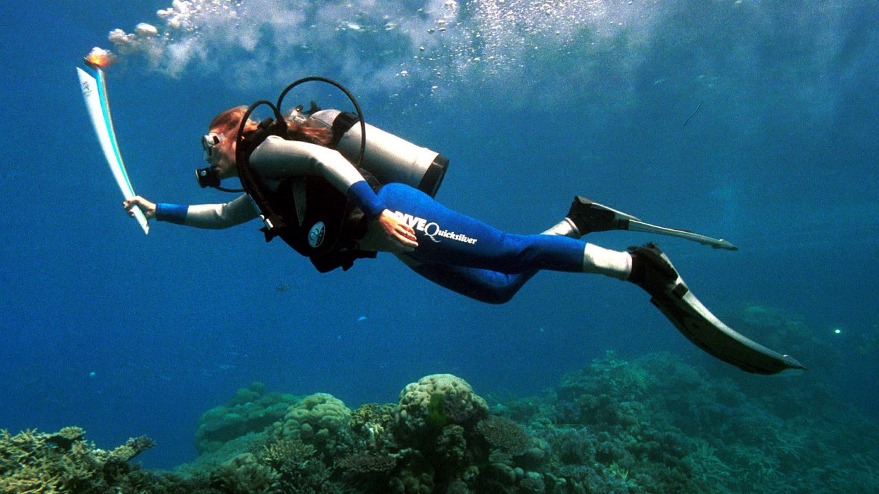 Wendy Craig-Duncan, a marine-biologist on Australia's Great Barrier Reef, took the torch underwater on its journey to Sydney in 2000.