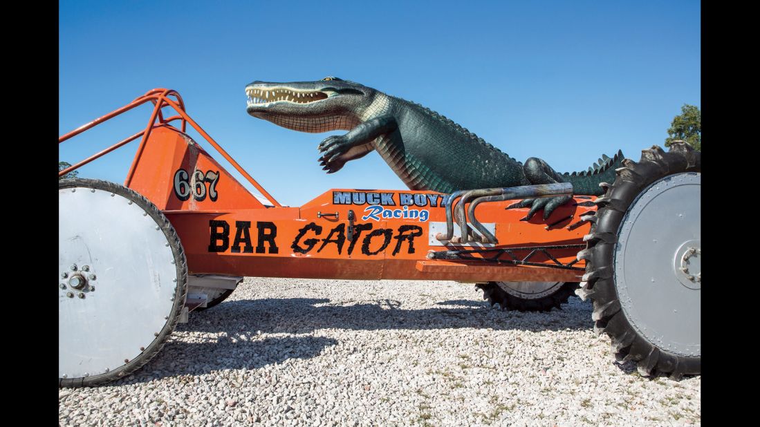 A fabricated alligator was mounted on the back of this swamp buggy driven by the late John "Allen" Barfield.