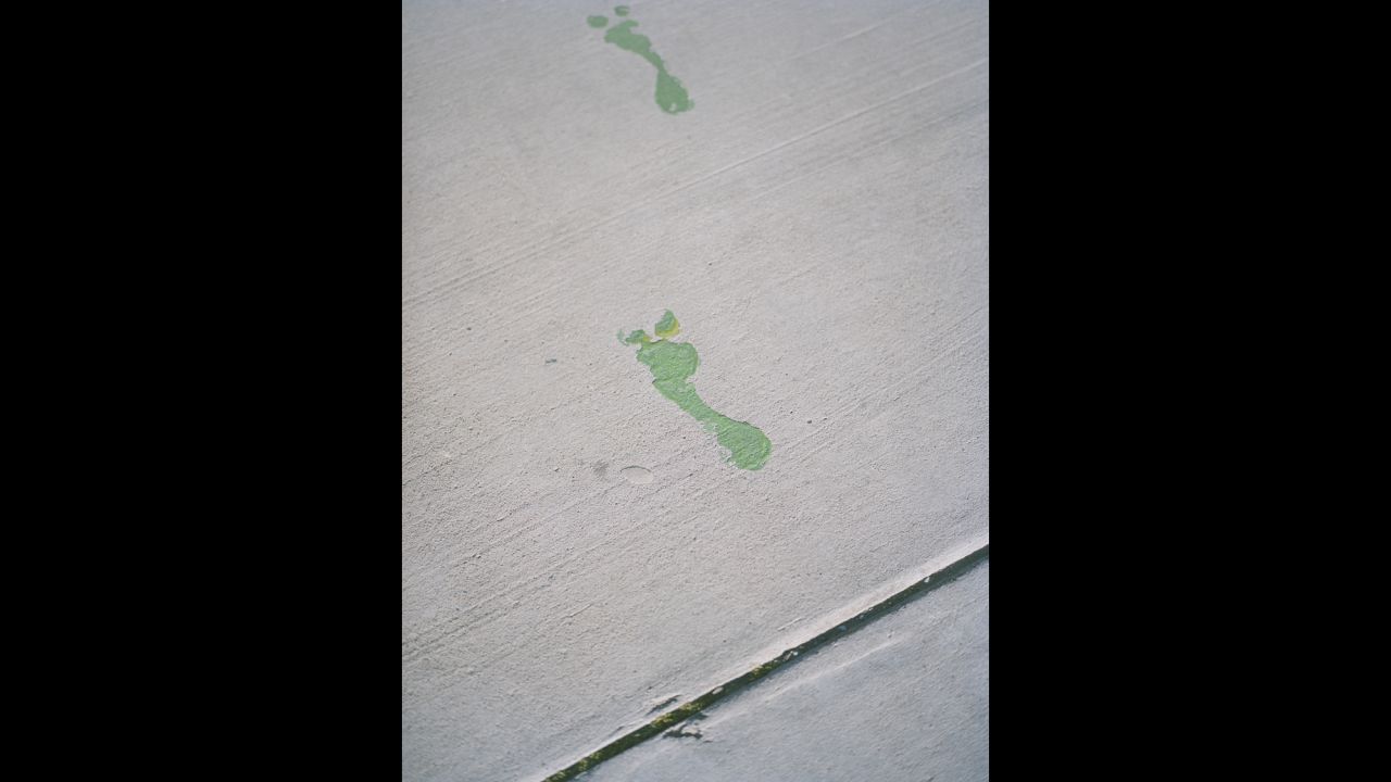 Footsteps are seen at North Main Street in Roswell. There are souvenir shops there selling UFO and alien merchandise.