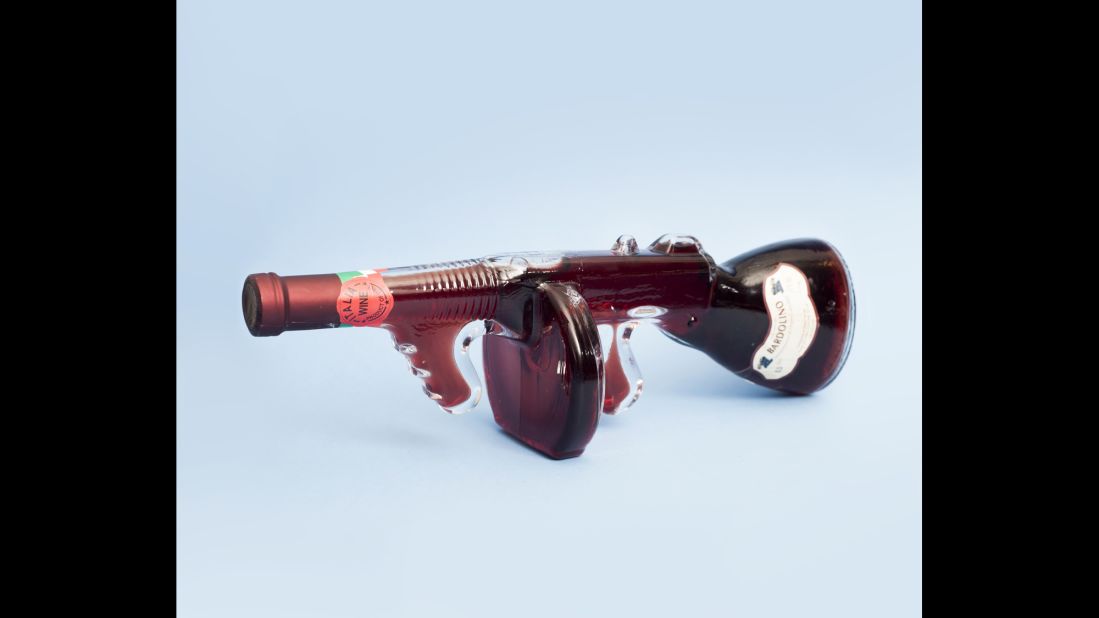 A wine bottle shaped like a machine gun.