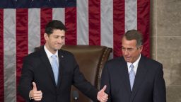 Newly elected Speaker of the House Paul Ryan, Republican of Wisconsin, (L) gives thumbs-ups alongside outside Speaker John Boehner, Republican of Ohio, after being elected Speaker in the House Chamber at the US Capitol in Washington, DC, October 29, 2015.