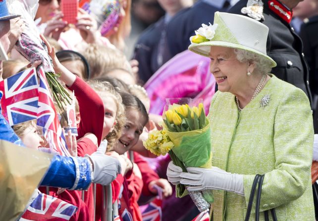 Queen Elizabeth II acknowledges the crowd as she celebrates her 90th birthday in Windsor, England, on April 21, 2016.