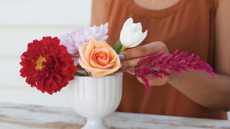 Next, add other big blooms to compliment the first one. 