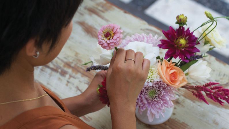 After you've added your focal point flowers, then fill in empty spots with filler flowers. 