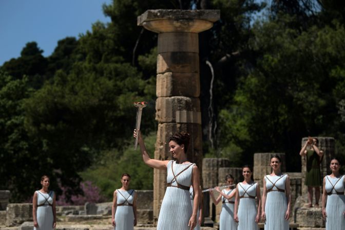 The traditions of the torch-lighting ceremony, which include playing of the ancient Greek instrument the lyra and the release of a white dove for peace, were established at the Berlin Games in 1936.  