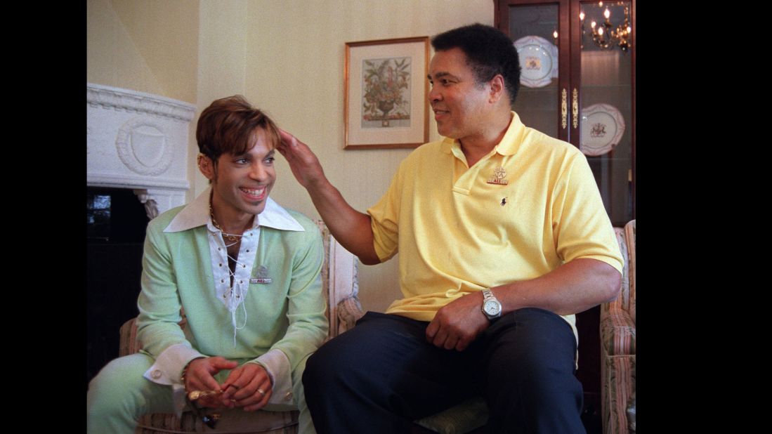 Muhammad Ali pats Prince's head prior to a news conference where they were to announce plans for a benefit concert in 1997.