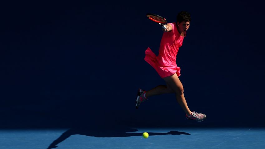 MELBOURNE, AUSTRALIA - JANUARY 20:  Caria Suarez Navarro of Spain plays a backhand in her second round match against Maria Sakkari of Greece during day three of the 2016 Australian Open at Melbourne Park on January 20, 2016 in Melbourne, Australia.  (Photo by Cameron Spencer/Getty Images)