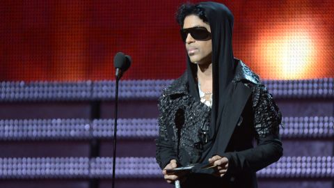 Prince presents the winner for Record of the Year to Gotye and Kimbra during the 55th Grammy Awards in 2013.