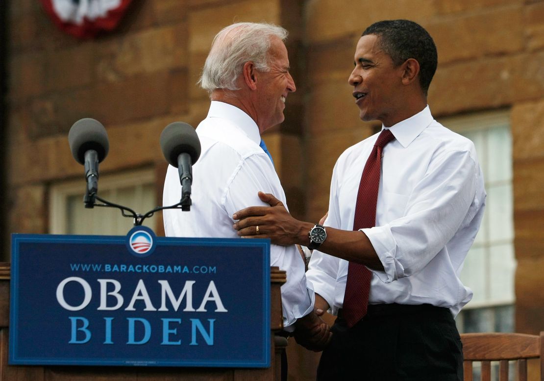 Then U.S. Sen. Barack Obama shakes hands with his Vice Presidential pick Sen. Joe Biden in front of the Old State Capitol August 23, 2008, in Springfield, Illinois.  