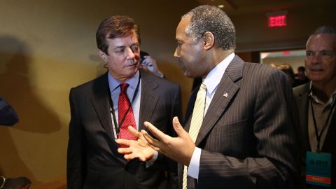 Donald Trump's political strategist Paul Manafort (L) speaks with former Republican presidential candidate Ben Carson as they arrive for a Trump for President reception with guests during the Republican National Committee Spring meeting at the Diplomat Resort on April 21 2016 in Hollywood, Florida.