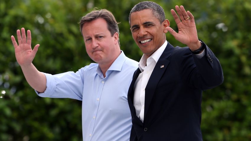 ENNISKILLEN, NORTHERN IRELAND - JUNE 17:  Britain's Prime Minister David Cameron (L) and US President Barack Obama (R) wave as they arrive at the G8 venue of Lough Erne on June 17, 2013 in Enniskillen, Northern Ireland. The two day G8 summit, hosted by UK Prime Minister David Cameron, is being held in Northern Ireland for the first time. Leaders from the G8 nations have gathered to discuss numerous topics with the situation in Syria expected to dominate the talks.  (Photo by Matt Cardy/Getty Images)