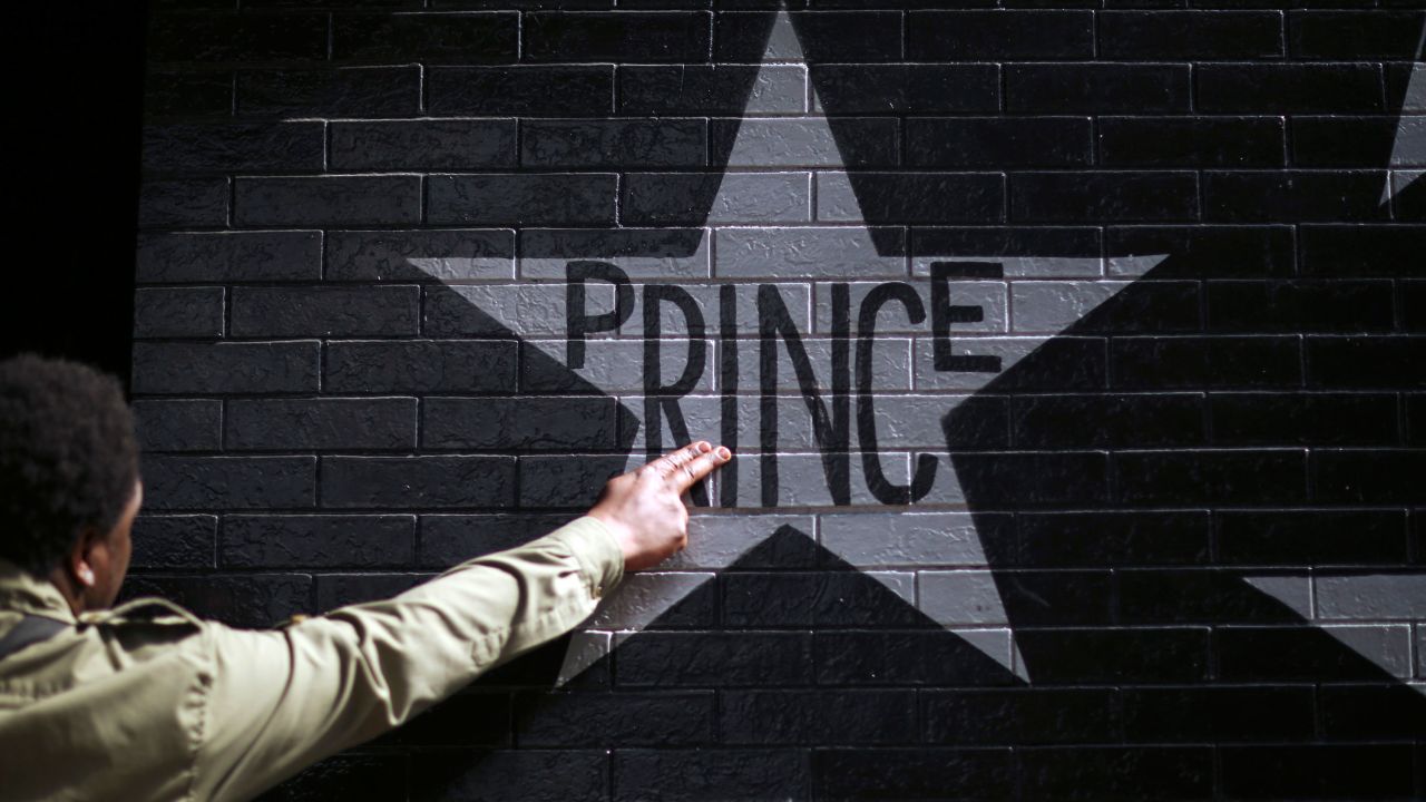 After kissing his fingers, a fan touches Prince's star on the wall of First Avenue and 7th St. Entry in Minneapolis, Minnesota, on April 21. The legendary musician died at his home in Minnesota at the age of 57.