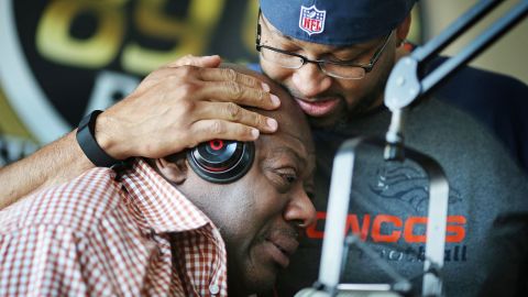 KMOJ DJs Walter "Q Bear" Banks, left, and Shed G embrace as they talk about the death of Prince on April 21.