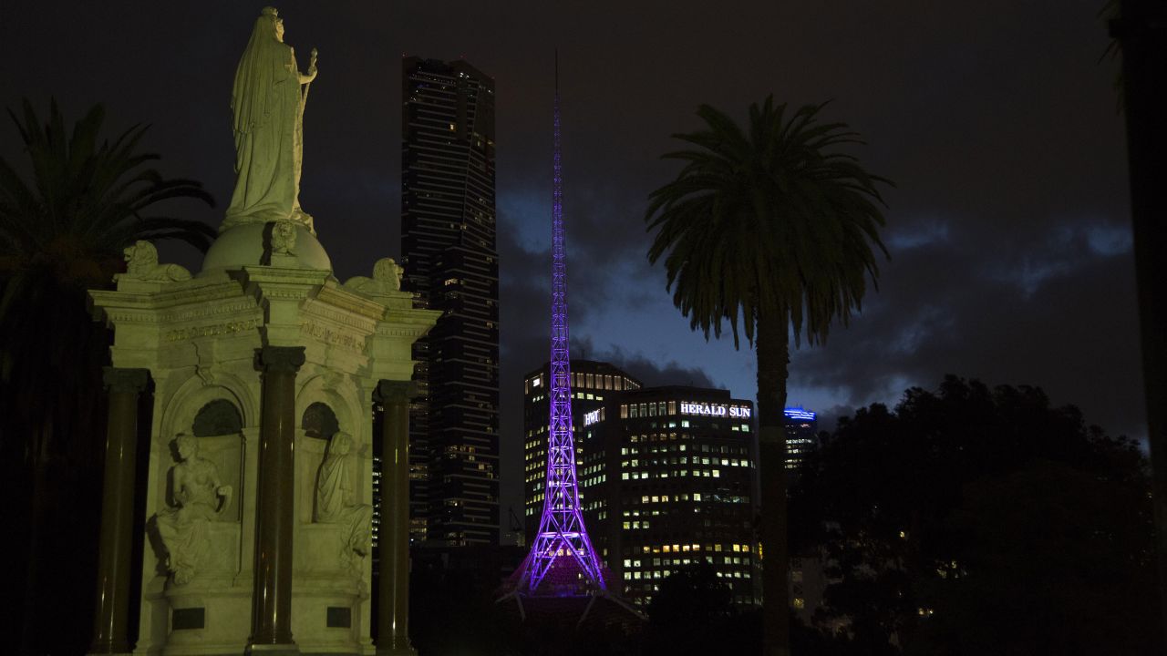 The Melbourne Arts center spire lights up in purple on April 22.