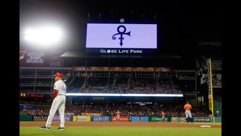 Prince's symbol is broadcast on the Texas Rangers video screen over the right field roof during a game between the Rangers and Houston Astros in Arlington, Texas.