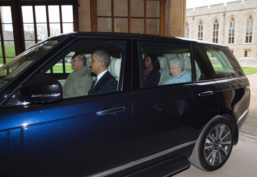 Philip drives the President, the first lady and Elizabeth from the helicopter into Windsor Castle after the Obama's arrived for a private lunch in Windsor, England, on April 22, 2016.  