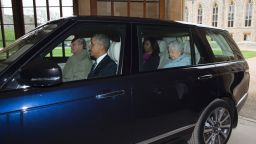 Britain's Prince Philip, Duke of Edinburgh drives US President Barack Obama, US First Lady Michelle Obama and Britain's Queen Elizabeth II from the helicopter into Windsor Castle after the Obama's arrived for a private lunch in Windsor, southern England, on April, 22, 2016.  