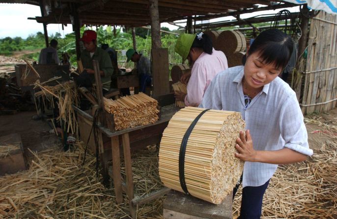 Bamboo chopsticks being made in a factory in Vietnam where thousands of chopsticks are made daily and exported to Japan. 