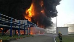 Location of the fire is at the Jiangsu Deqiao Storage Company Ltd in the New Port Industrial Park in Jingjiang city.  The fire reached 20 - 30 meters in the air with thick mushroom-like smoke.  According to rescue workers at the scene, the burning articles were two gas containers.  The company's main business is in storing, transferring, repartitioning and packaging liquid oil/gas products.  The factory zone has 12 fuel containers, diesel containers and gasoline containers, and 30 chemical storage containers.  The report also quotes a villager Mr. Zhong, whose home is within 1km away from the storage zone that there are two villages near the company with over 1k villagers (altogether).