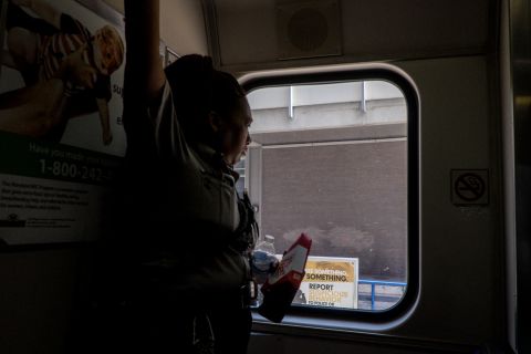  A security guard looks out the window of a Tram rail car in downtown Baltimore. An ambitious rail project that would have connected the black community in West Baltimore to other areas of the city was recently killed by the governor.<br /> <br />