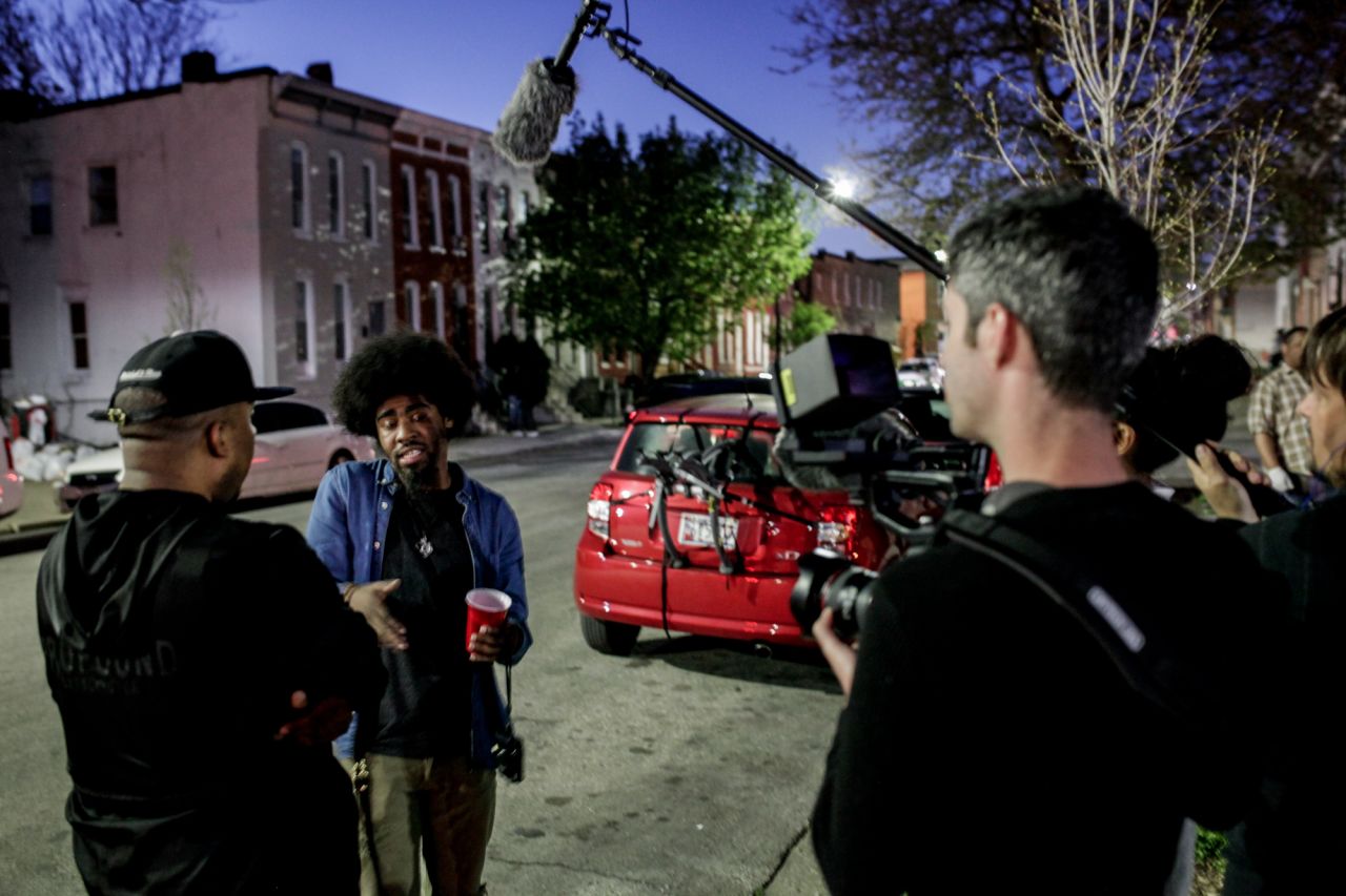 Photographer Devin Allen talks with a friend on camera for an upcoming HBO documentary on Baltimore. Allen was thrust into the national stage after his coverage of the riots on Instagram landed his work on the cover of TIME magazine. <br />