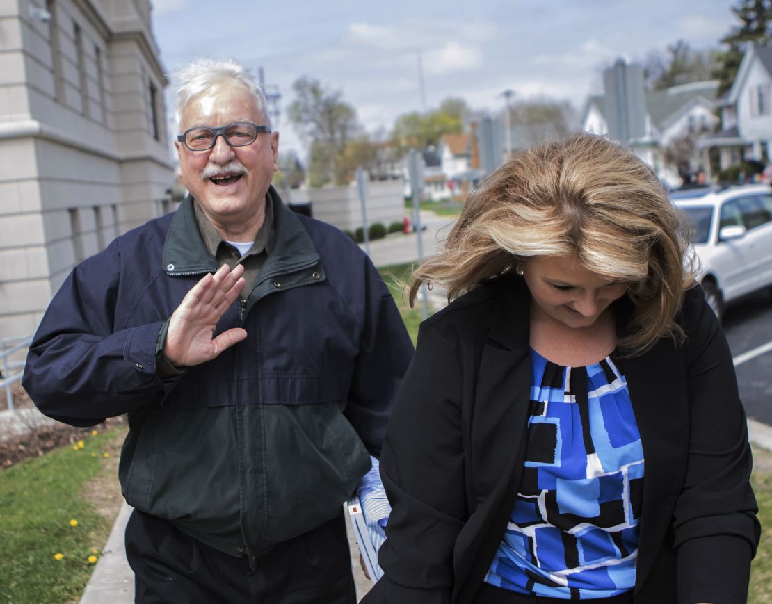Jack McCullough walks out of the DeKalb County Courthouse in Sycamore, Illinois, with Crystal Harrolle, an investigator with the public defender's office. 