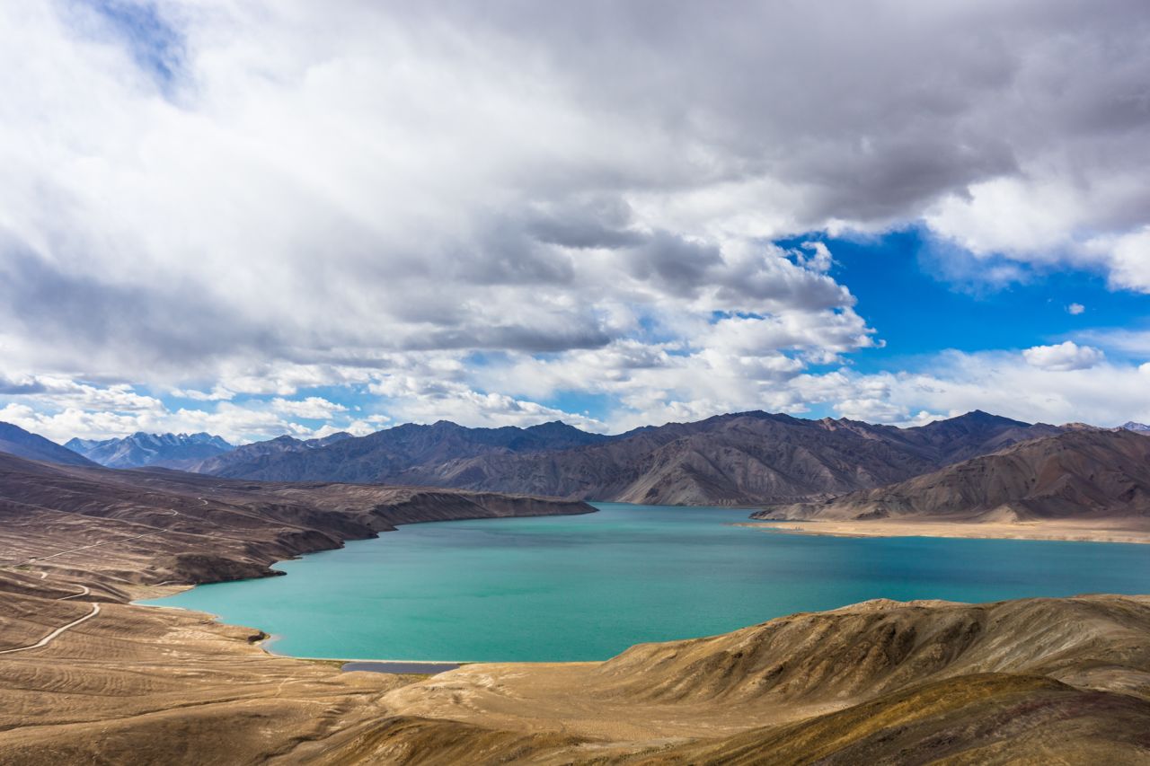 Vast Bulunkul Lake spreads across the Tajik landscape.