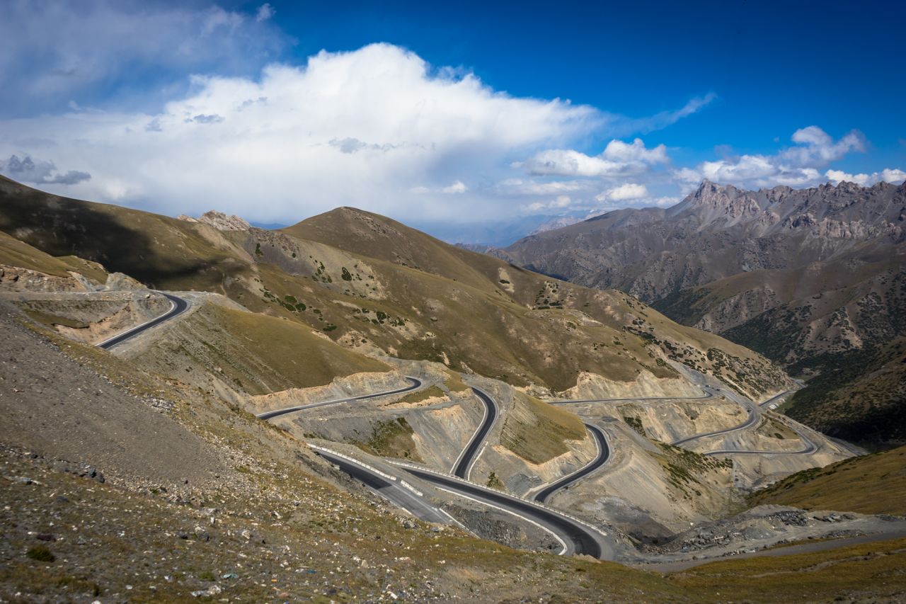 A new section of the Pamir Highway winds up a steep mountain in Kyrgyzstan.