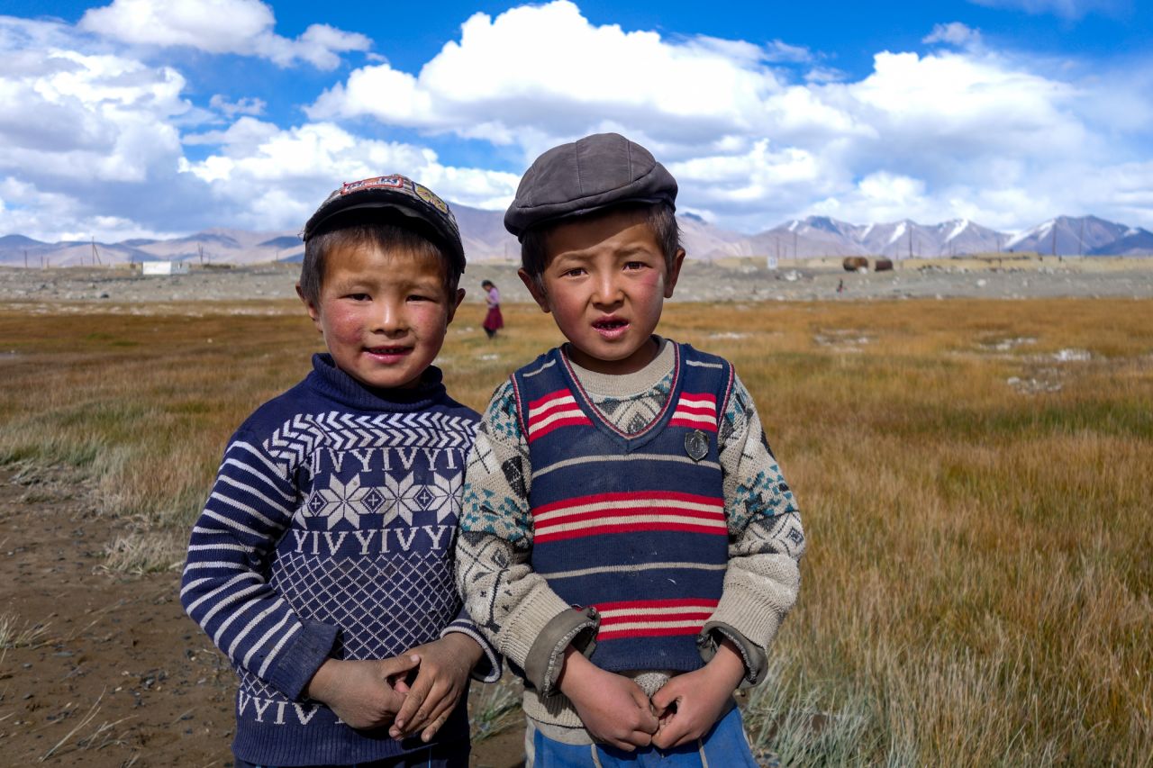 These stylish Karakul Lake boys chased the author down to have their picture taken, a common experience on the Pamir Highway.