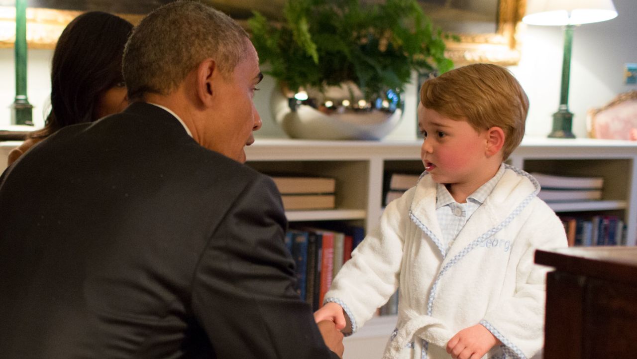 LONDON, ENGLAND - APRIL 22:   In this handout provided by The White House, President Barack Obama, Prince William, Duke of Cambridge and First Lady Michelle Obama talks with Prince George at Kensington Palace on April 22, 2016 in London, England. The President and his wife are currently on a brief visit to the UK where they attended lunch with HM Queen Elizabeth II at Windsor Castle and later dinner with Prince William and his wife Catherine, Duchess of Cambridge at Kensington Palace. Mr Obama visited 10 Downing Street this afternoon and held a joint press conference with British Prime Minister David Cameron where he stated his case for the UK to remain inside the European Union. (Photo by Pete Souza/The White House via Getty Images)