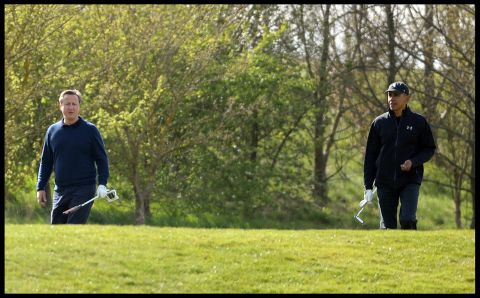 British Prime Minister David Cameron and Obama play golf at the Grove Golf Club on April 23.