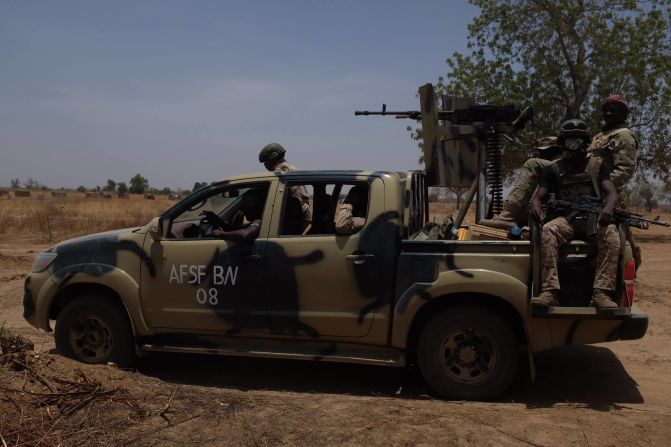 A vehicle full of troops scans the horizon scouting for any indication of insurgent presence.