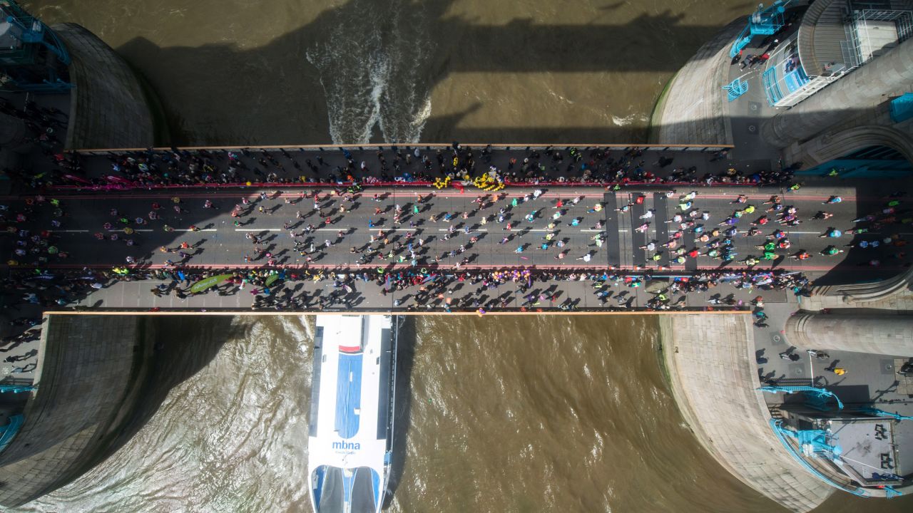 Runners cross the River Thames over Tower Bridge during the London Marathon on Sunday, April 24.