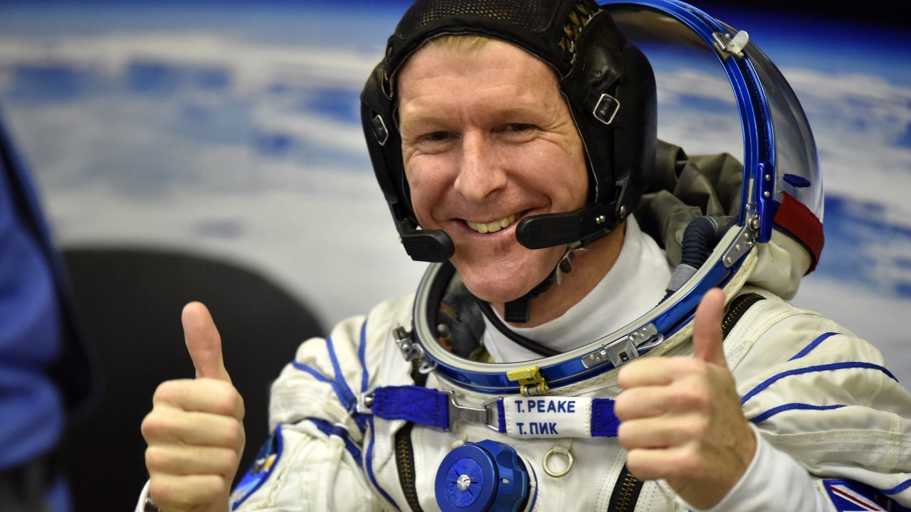 Britain's astronaut Tim Peake gestures as his space suit is tested at the Russian-leased Baikonur cosmodrome, prior to blasting off to the International Space Station (ISS), on December 15, 2015. Russia's Soyuz TMA-19M spacecraft carrying the International Space Station (ISS) Expedition 46/47 crew of Britain's astronaut Tim Peake, Russian cosmonaut Yuri Malenchenko and US astronaut Tim Kopra is scheduled to blast off to the ISS on December 15, 2015. AFP PHOTO / KIRILL KUDRYAVTSEV / AFP / KIRILL KUDRYAVTSEV        (Photo credit should read KIRILL KUDRYAVTSEV/AFP/Getty Images)