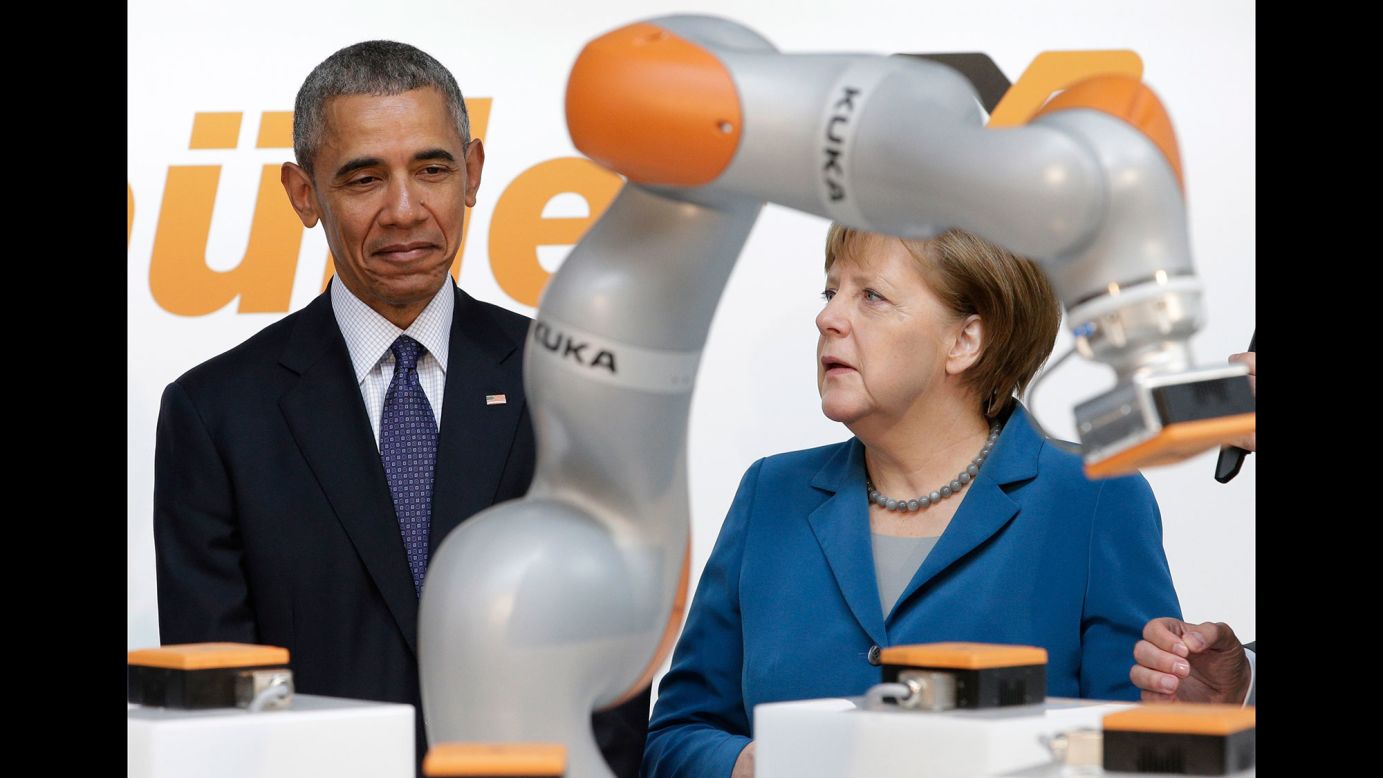 Obama and Merkel look at a robotic device April 25 as they tour the Hannover Messe, the world's largest trade fair for industrial technology.