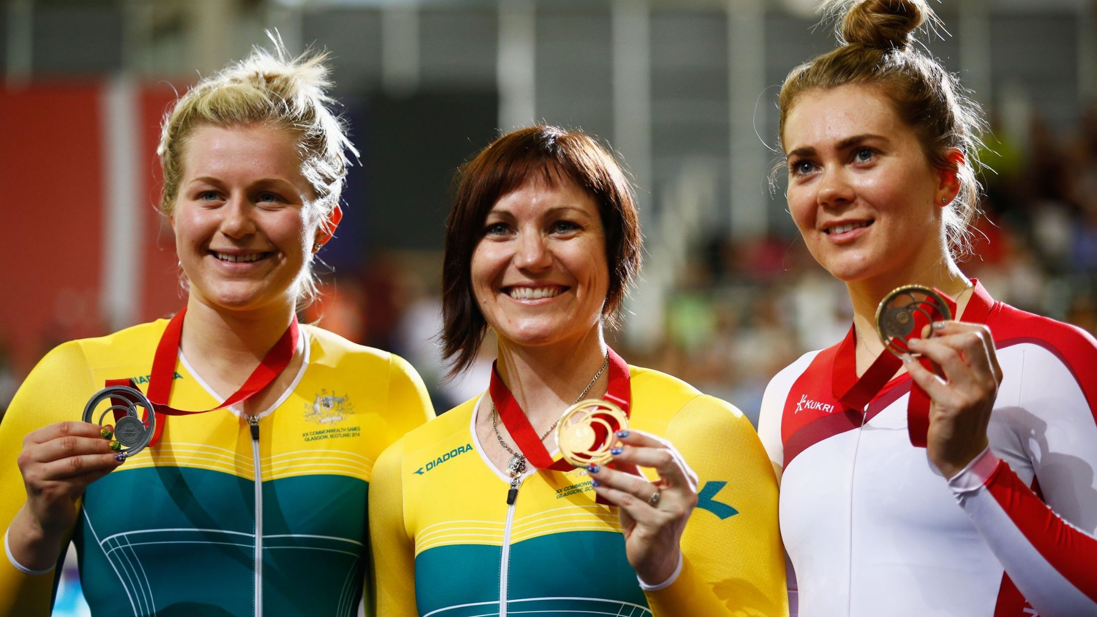 Varnish (far right) poses with bronze medal at the 2014 Commonwealth Games in Glasgow, Scotland.