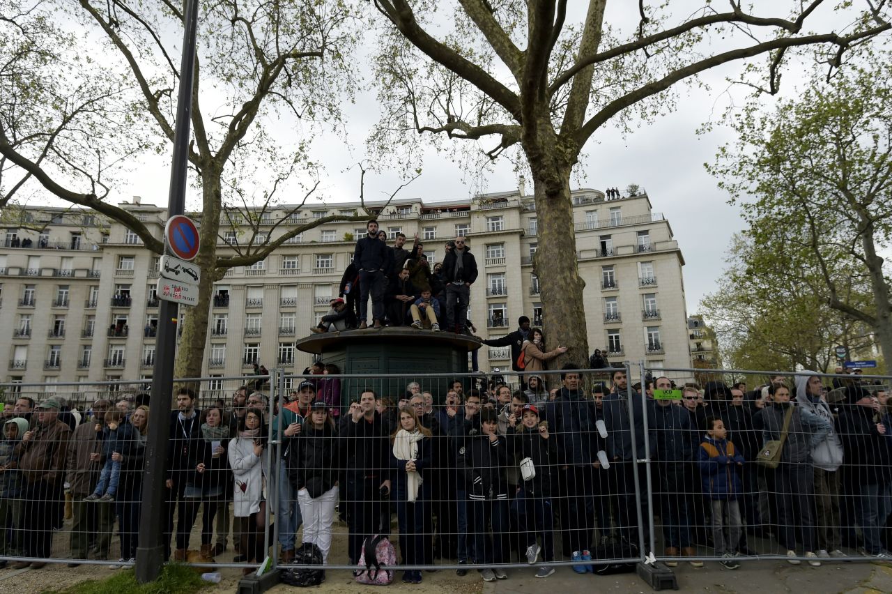 Those without tickets lined the fences along the circuit to try and sneak a peak of the racing action.